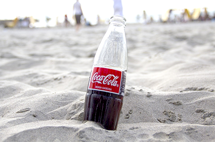 coca cola bottle beach sand