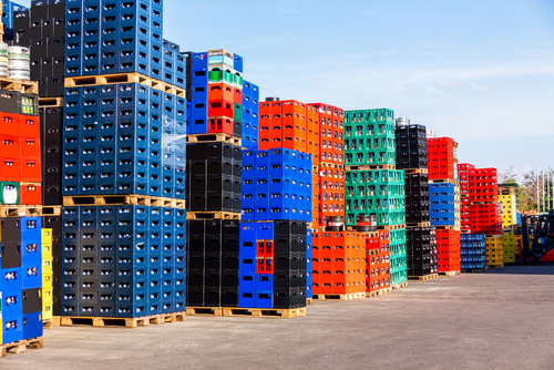 several stacks colorful beverage bottle crates