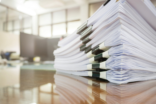 stack of papers in focus with blurred background
