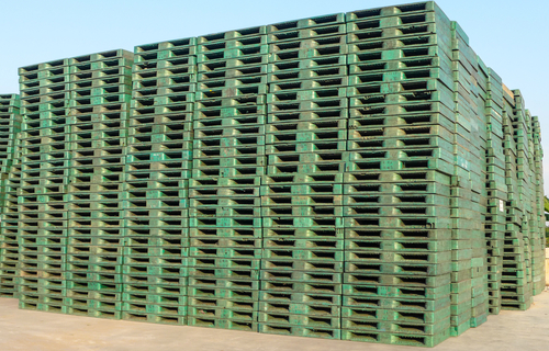 green plastic pallets stacked