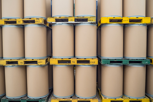 fiber barrels on warehouse shelving