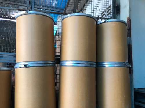 stacks of fiber barrels in warehouse