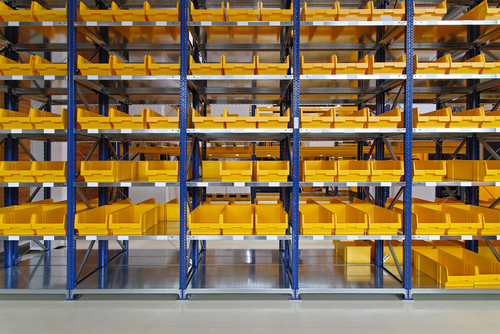 yellow plastic bin trays in warehouse