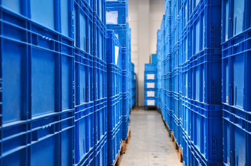 blue plastic containers in warehouse