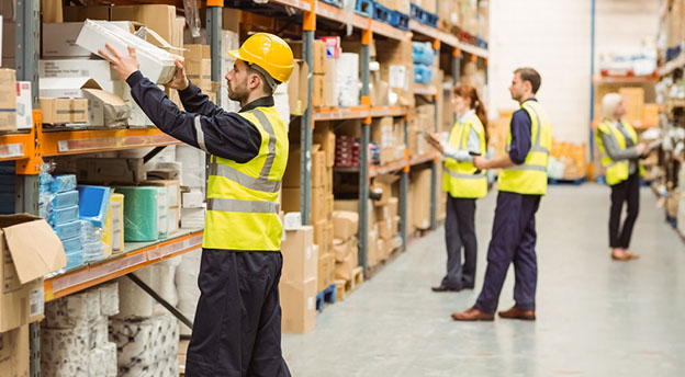 warehouse workers organizing storage containers
