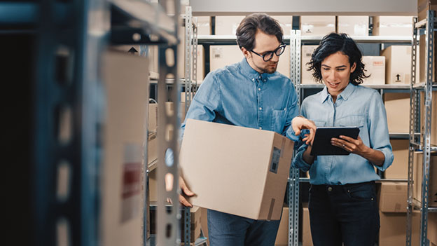 employees reviewing information on tablet