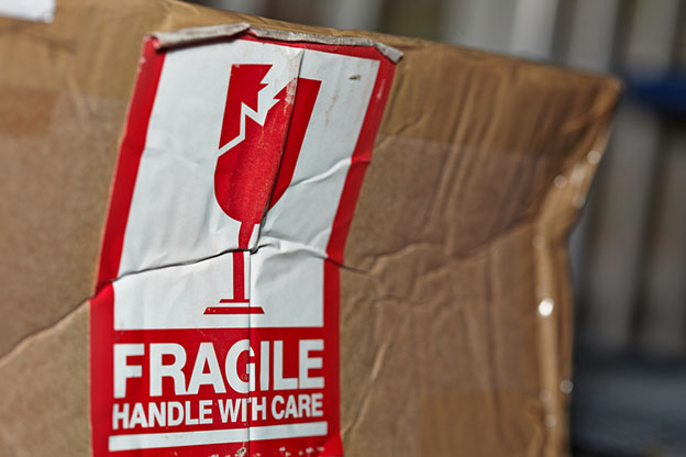 damaged box marked with fragile sticker
