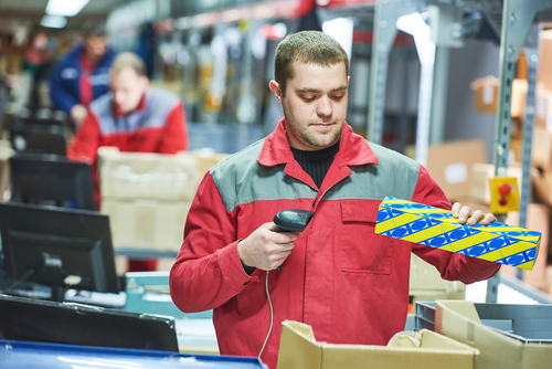 warehouse worker scanning package