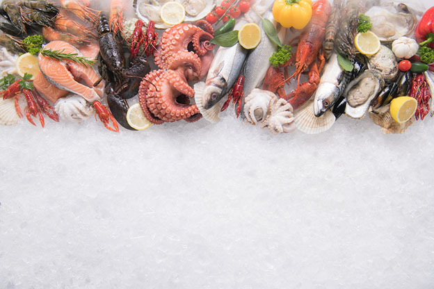 Top view of variety of fresh fish and seafood
