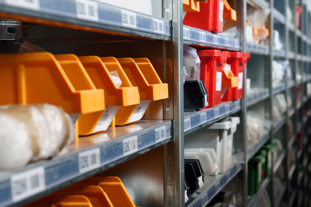 a close up of racks with small bins for components and small parts
