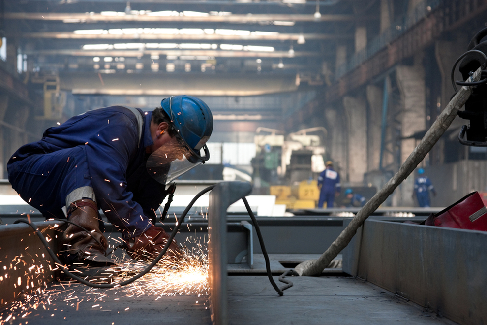 a worker welding with a protective mask