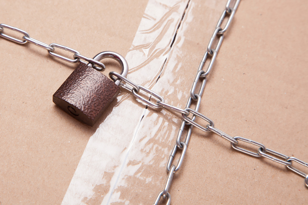 a cardboard box with a lock and chain
