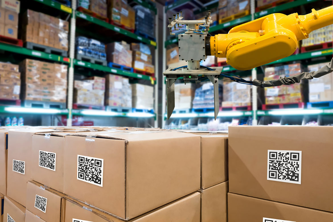 robotic arm over boxes in warehouse